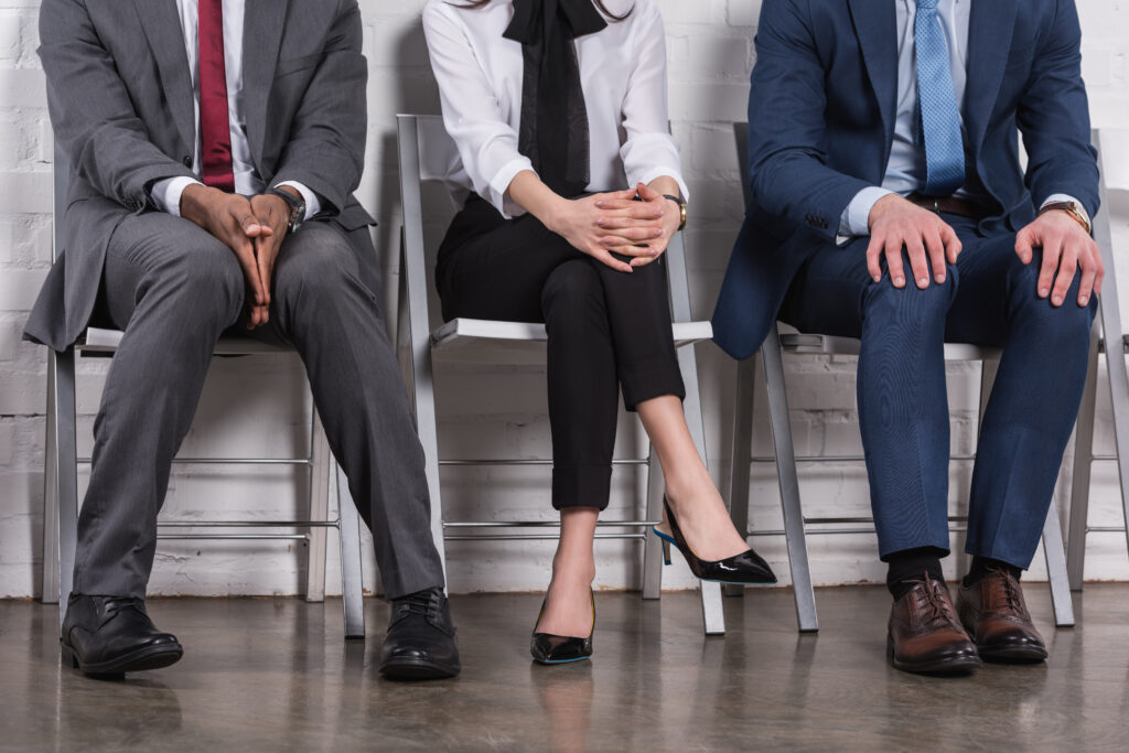 Partial view of business professionals seated in a row
